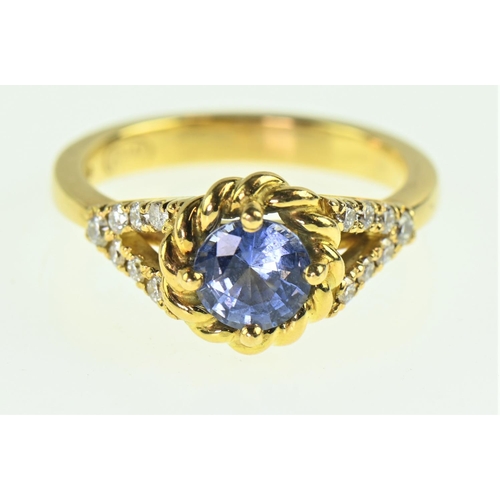 85 - Sapphire and diamond 18ct gold ring, the cornflower blue sapphire measuring 7mm diameter, flanked wi... 