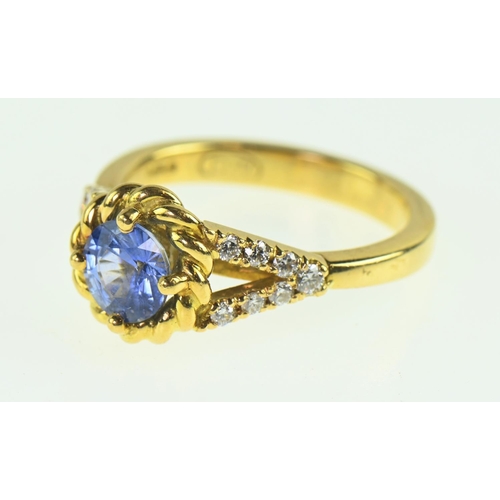 85 - Sapphire and diamond 18ct gold ring, the cornflower blue sapphire measuring 7mm diameter, flanked wi... 