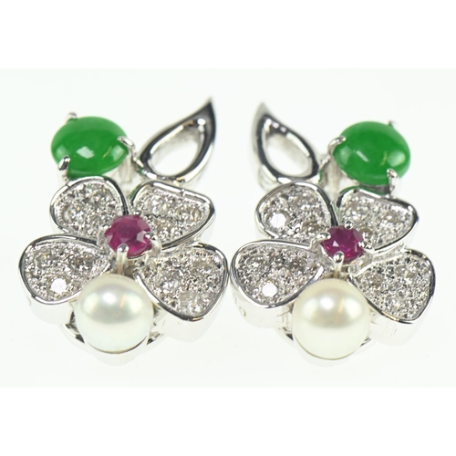 88 - Pair of 18ct gold white flower clip earrings, set with ruby, emerald, pearl and melee diamonds, fold... 