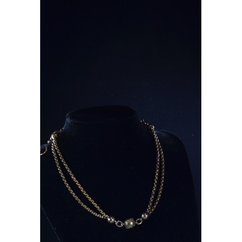 98 - 9ct gold fob chain with gold beads, clasp and hook, 25.6 grams