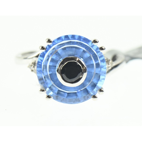 106 - 9ct white gold, blue stone and diamond ring, size N1/2, 4 grams