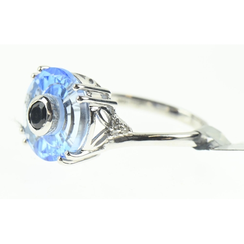 106 - 9ct white gold, blue stone and diamond ring, size N1/2, 4 grams