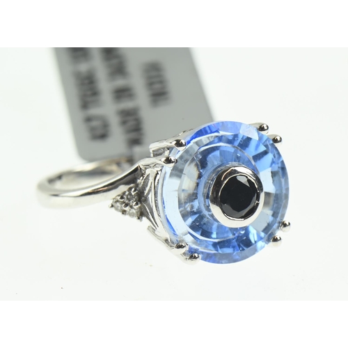 106 - 9ct white gold, blue stone and diamond ring, size N1/2, 4 grams