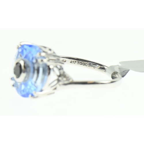 106 - 9ct white gold, blue stone and diamond ring, size N1/2, 4 grams