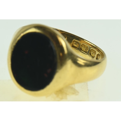 127 - 18ct gold signet ring set with bloodstone size P, gross weight 9 grams