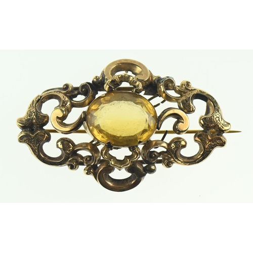 131 - Yellow metal bar brooch set with a yellow stone, areas test positive for 9ct gold, gross weight 15.8... 