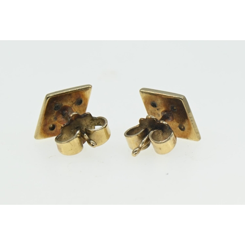 141 - Pair of 9ct gold and diamond ear studs of diamond shape, gross weight 1.76 grams