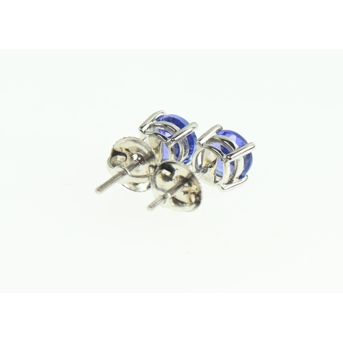 154 - Pair of platinum and tanzanite ear studs, with screw post fittings, gross weight 1.96 grams