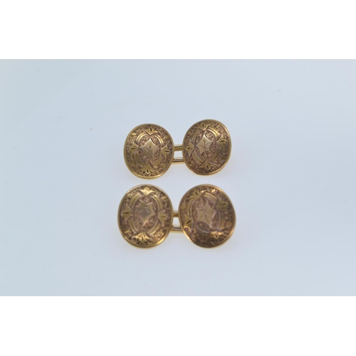 189 - Pair of 15ct gold cufflinks, hallmarked London 1928, the oval faces engraved with leaves, length of ... 