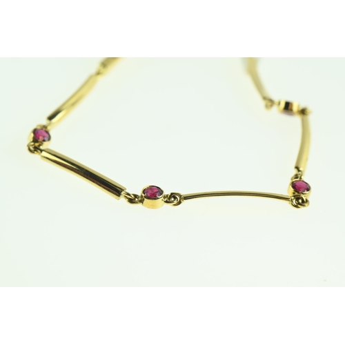 195 - 18ct gold and ruby bracelet, circumference 165mm, gross weight 5.05 grams