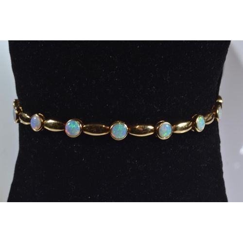 197 - 18ct gold and opal bracelet, circumference 182mm, gross weight 11.09 grams