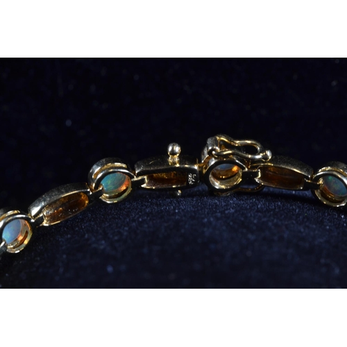 197 - 18ct gold and opal bracelet, circumference 182mm, gross weight 11.09 grams