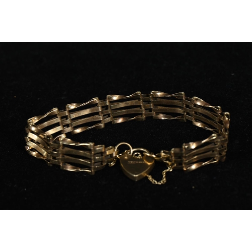 206 - 9ct gold gate link bracelet with heart-shaped clasp and safety chain, gross weight 9.48 grams