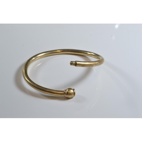 209 - Yellow metal baby/child's bangle, testing positive for 9ct gold, 48 x 44mm, gross weight 5.31 grams