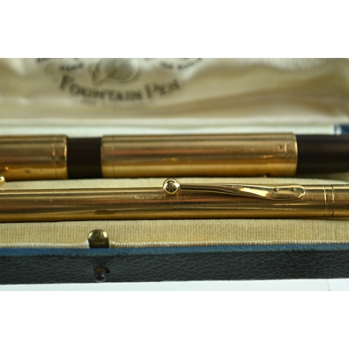 272 - Waterman's 9ct gold cased 'Ideal' fountain pen with a 14ct gold nib and 9ct gold cased propelling pe... 