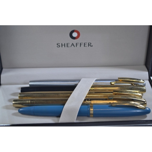 285 - Five 14k gold nibbed Sheaffer pens inc, one Australian and two with rolled gold case.