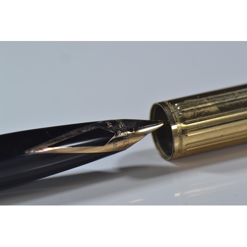 285 - Five 14k gold nibbed Sheaffer pens inc, one Australian and two with rolled gold case.