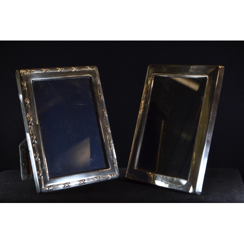 297 - Two silver photo frames, including: a rectangular frame by Carr's of Sheffield Ltd, Sheffield 1990, ... 