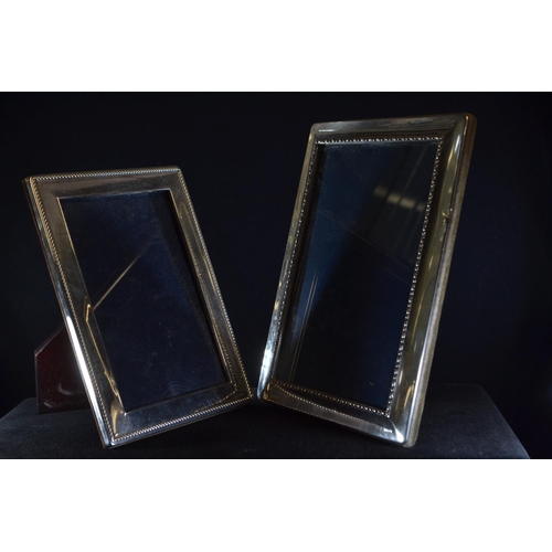 298 - Two silver rectangular photo frames, Carr's of Sheffield Ltd, Sheffield 1993 and 1996 respectively, ... 