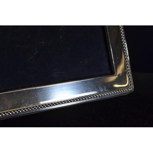 298 - Two silver rectangular photo frames, Carr's of Sheffield Ltd, Sheffield 1993 and 1996 respectively, ... 