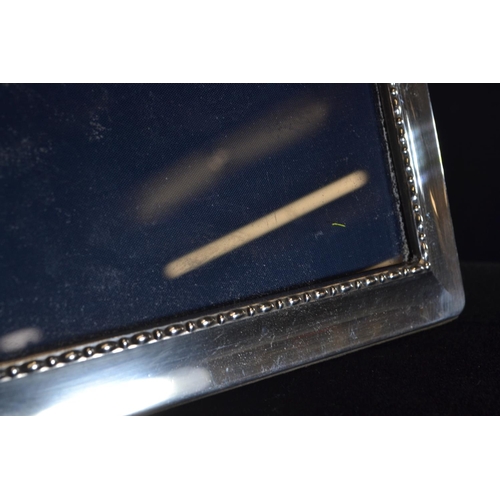 298 - Two silver rectangular photo frames, Carr's of Sheffield Ltd, Sheffield 1993 and 1996 respectively, ... 