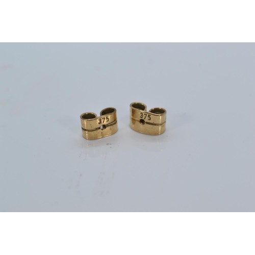 144 - Pair of diamond earrings on 9ct gold. Gross weight 2.34g