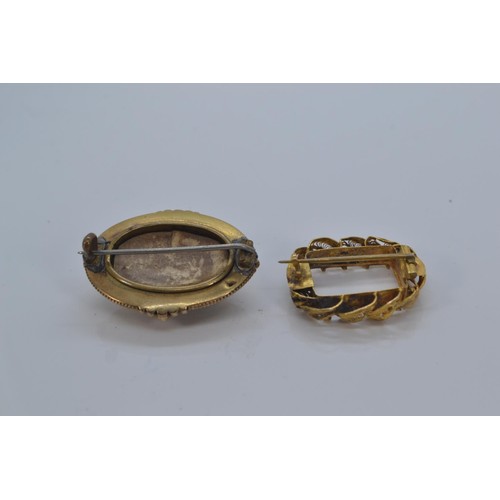 146 - Two yellow metal mourning brooches (testing positive for 18ct gold) including one filigree, gross we... 