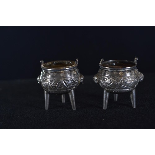 308 - Pair of Chinese export silver salts, in the form of incense burners, with glass liners, indecipherab... 