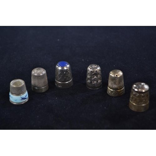 319 - Six silver thimbles, various makers and dates, including one by James Swann & Son Birmingha... 