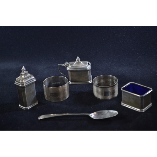 330 - Silver three piece cruet set, Adie Brothers Ltd, Birmingham 1929, the salt and mustard with blue gla... 