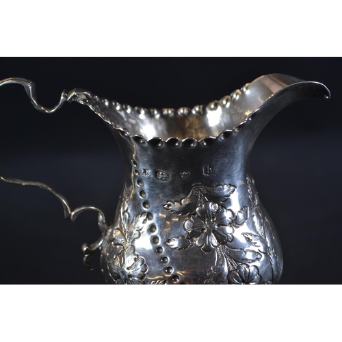 345 - George III silver pedestal cream jug, maker's mark unclear, London 1783, later embossed with fo... 