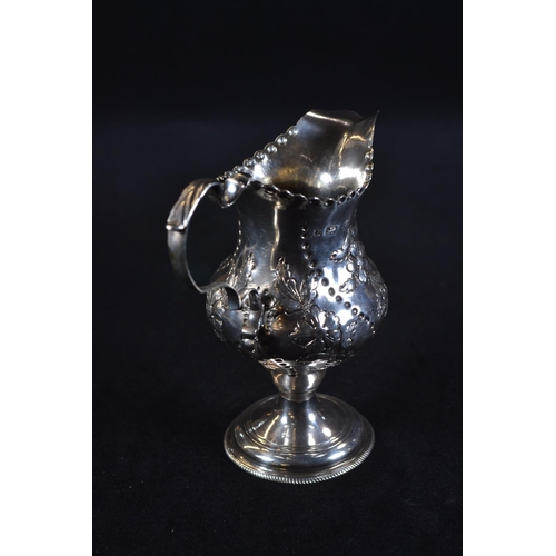 345 - George III silver pedestal cream jug, maker's mark unclear, London 1783, later embossed with fo... 