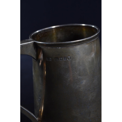 350 - Silver tankard, Charles Boyton, London 1934, of tapering form, initialled 'GPWC 6.9.35' height ... 