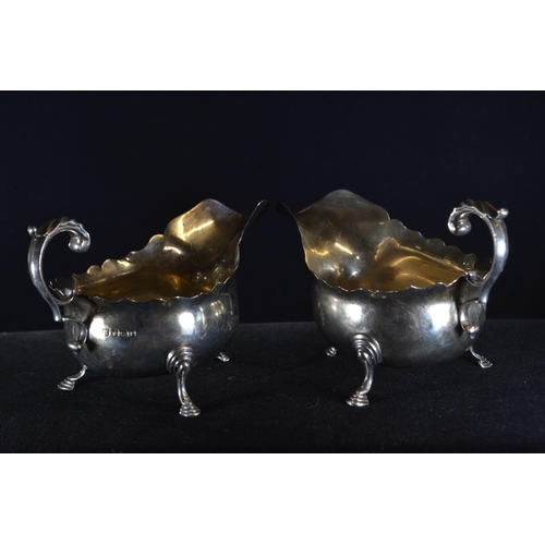 361 - Pair of silver sauce boats, Thomas Bradbury & Sons Ltd, Sheffield 1932, each raised on three fee... 