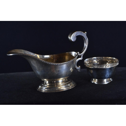 370 - Silver sauce boat, William Neale & Son, Birmingham 1933, with scroll handle, length 15cm, togeth... 