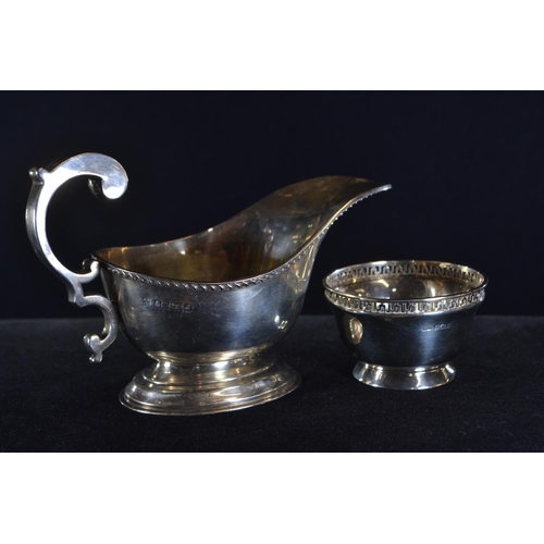 370 - Silver sauce boat, William Neale & Son, Birmingham 1933, with scroll handle, length 15cm, togeth... 