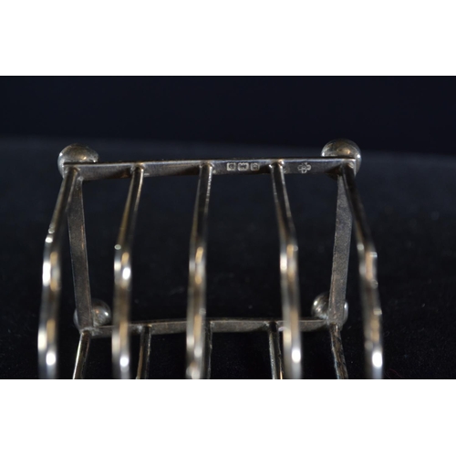 387 - Two silver toast racks, Mappin & Webb Ltd and William Base & Sons Birmingham 1932 and 1928 r... 