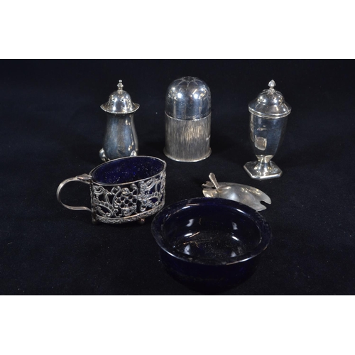 388 - Three silver pepperettes and a silver salt with blue glass liner, various maker's and dates, silver ... 