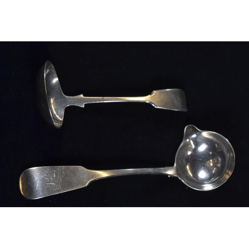 390 - Two silver fiddle pattern sauce ladles, including: George IV Irish sauce ladle with pouring lip... 