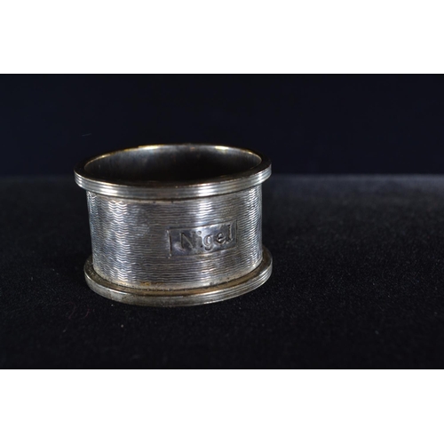 392 - Six silver napkin rings, various maker's and dates, including a pair, each inscribed/initialled, gro... 