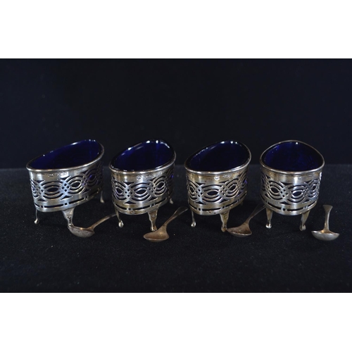 413 - Set of four silver pierced navette-shaped salts, William Aitken, Birmingham 1903, with blue glass li... 