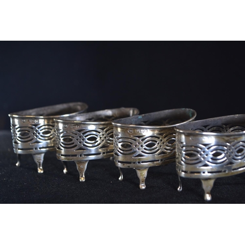 413 - Set of four silver pierced navette-shaped salts, William Aitken, Birmingham 1903, with blue glass li... 