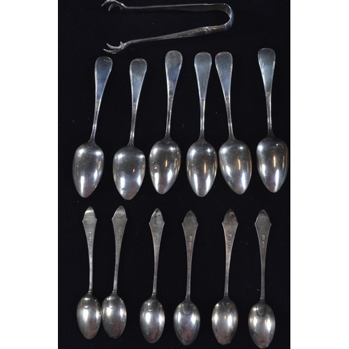 419 - Set of six silver teaspoons and pair of sugar tongs, marked 'Sterling', together with a set of six s... 