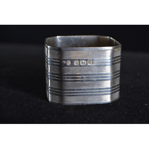 420 - Eight silver napkin rings, various makers and dates, including a pair and one 830 silver, gross weig... 