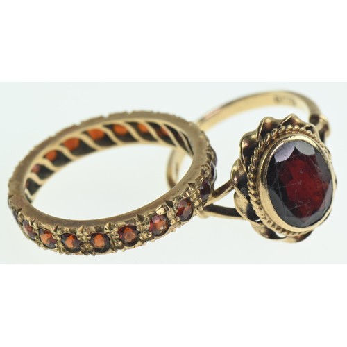 230 - Two 9ct gold and red stone rings, eternity ring size P1/2, single stone ring band misshapen, gross w... 