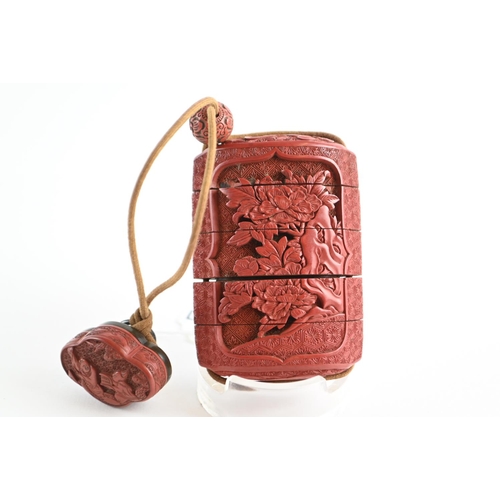 476 - Japanese cinnabar  four-case inro, carved with a dragon to one side and flowers to the other side, w... 