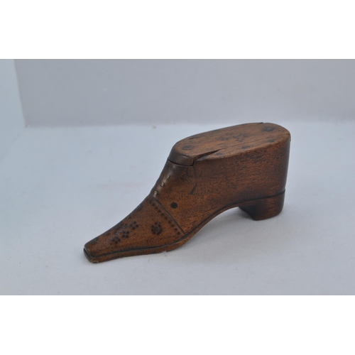 484 - 19th century carved wood shoe snuff box, with sliding cover and metal pinned decoration, length 10cm