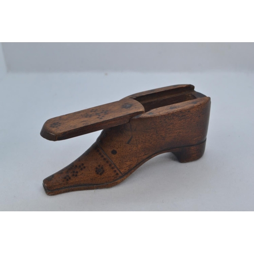 484 - 19th century carved wood shoe snuff box, with sliding cover and metal pinned decoration, length 10cm