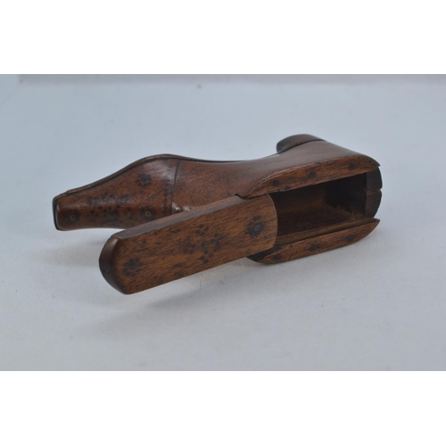 484 - 19th century carved wood shoe snuff box, with sliding cover and metal pinned decoration, length 10cm