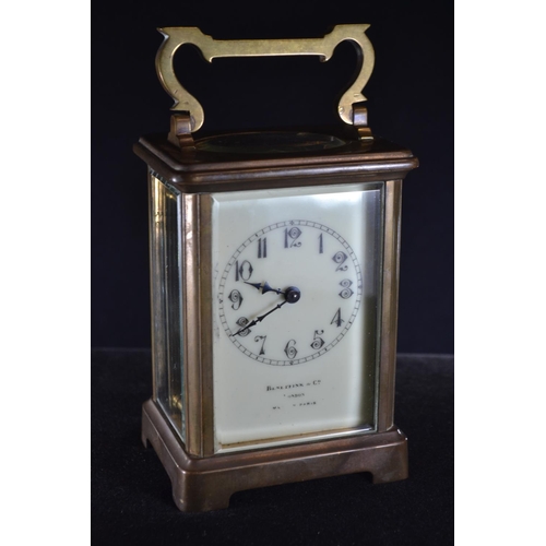 488 - A late 19th/early 20th century brass and bevelled glass cased carriage clock by Benetfink & Co L... 